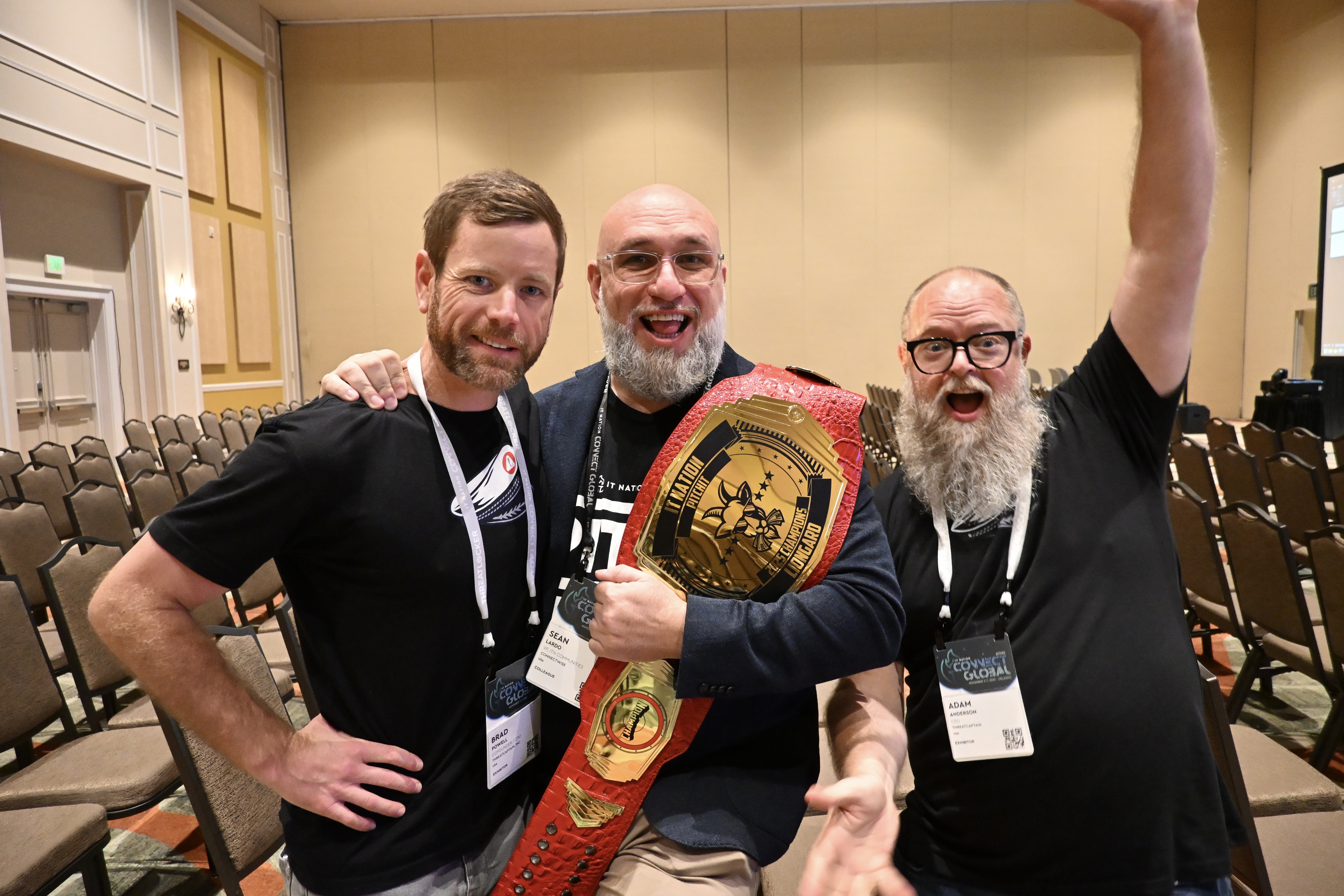 PitchIT attendees holding winner belt